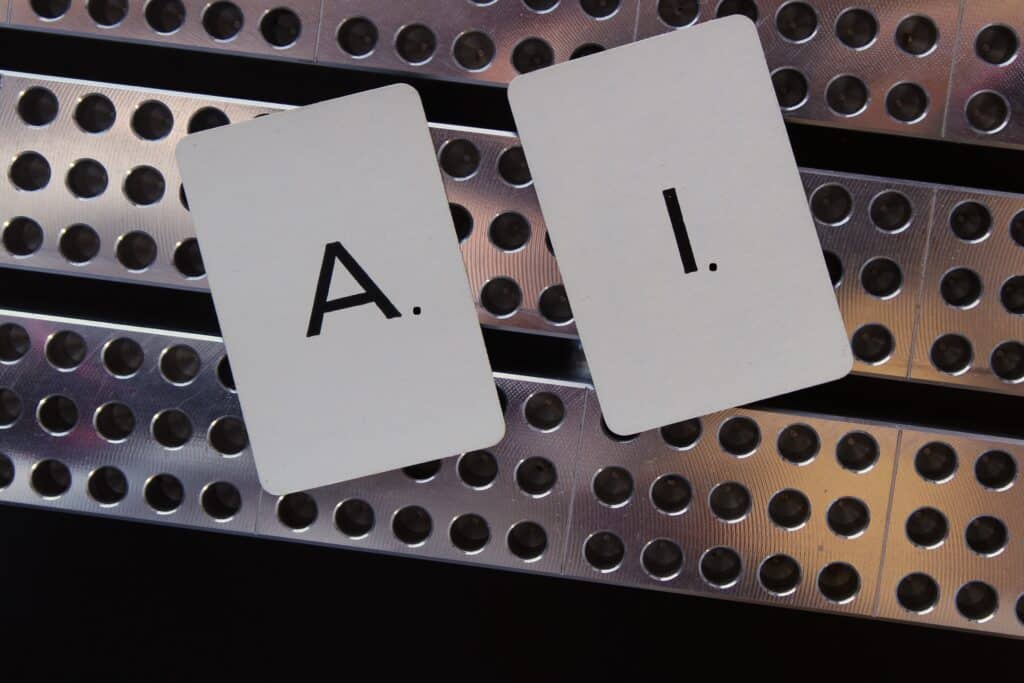 AI artificial intelligence concept with the letters laying on metal background