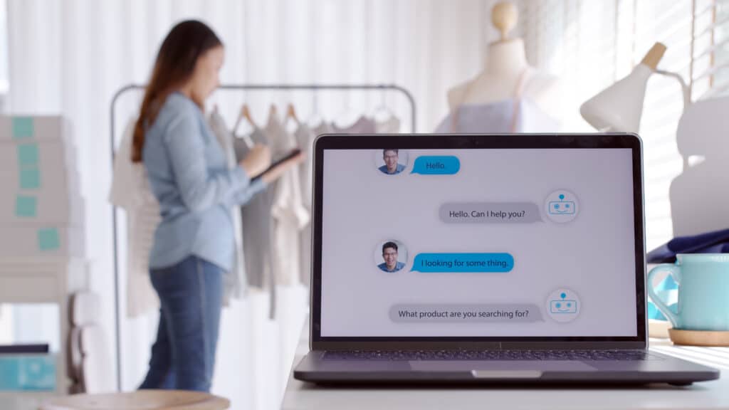 Marketing automation concept with Chatbot conversation on laptop screen app interface with artificial intelligence technology providing virtual robotic assistant customer support