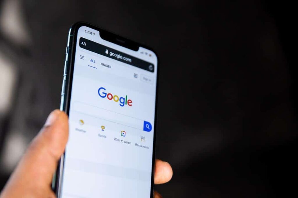 generate b2b leads concept with cell phone and google on screen